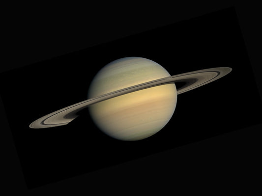 Saturn and its rings against the black void of space